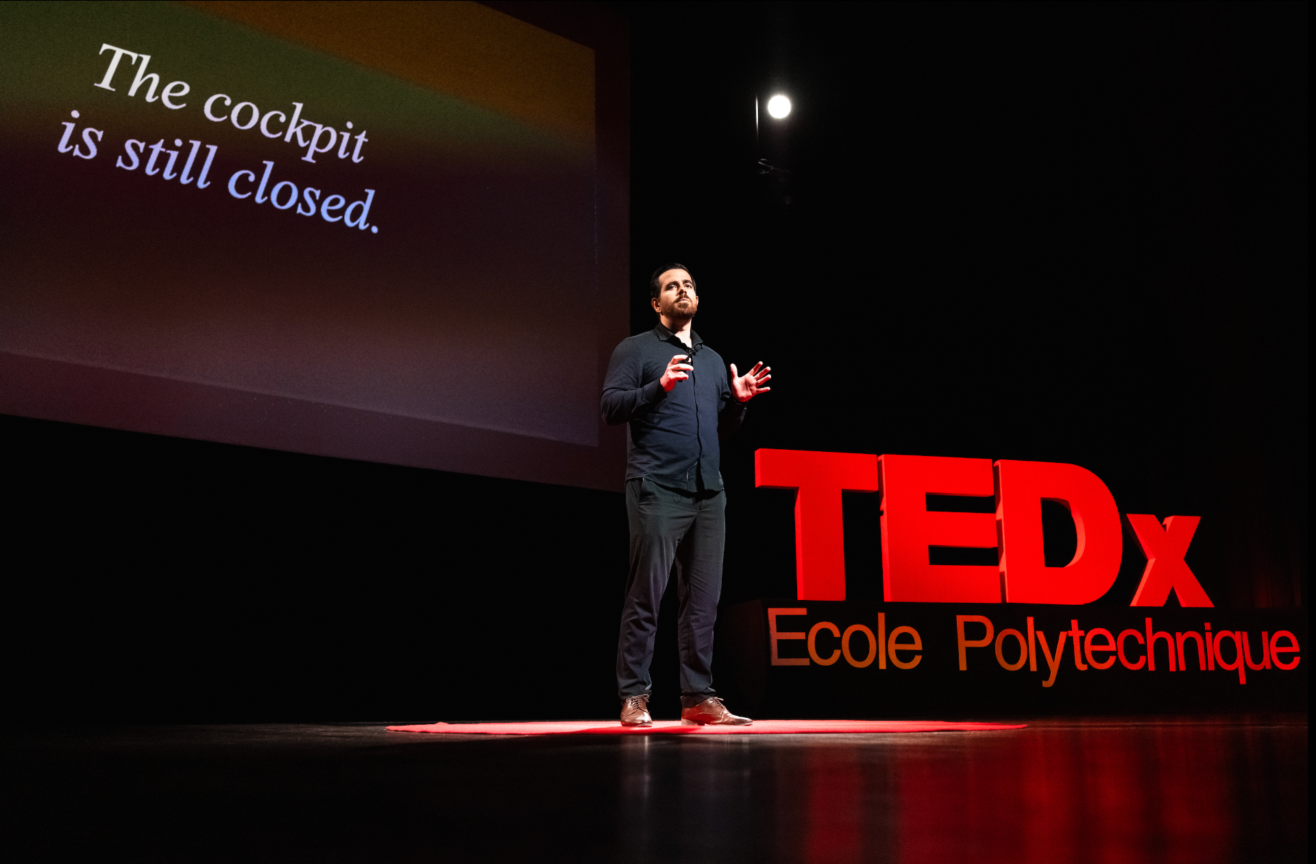 Douglas Moreau on stage at TEDxÉcolePolytechnique, 12 May 2026